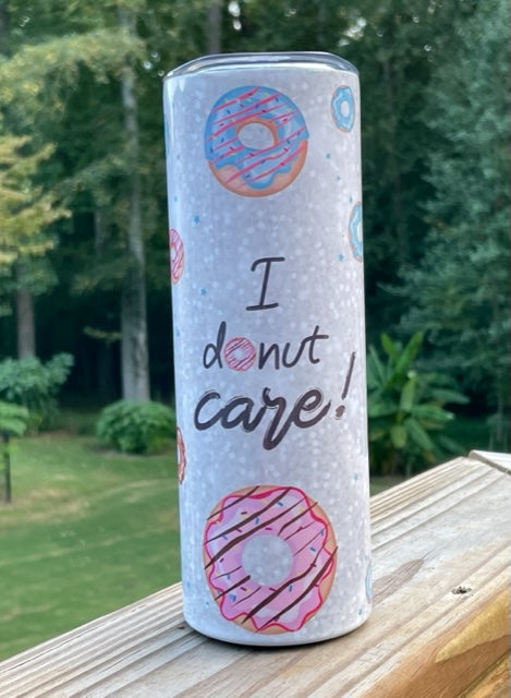 20oz I Donut Care stainless steel tumbler with pink and blue frosted donuts. 